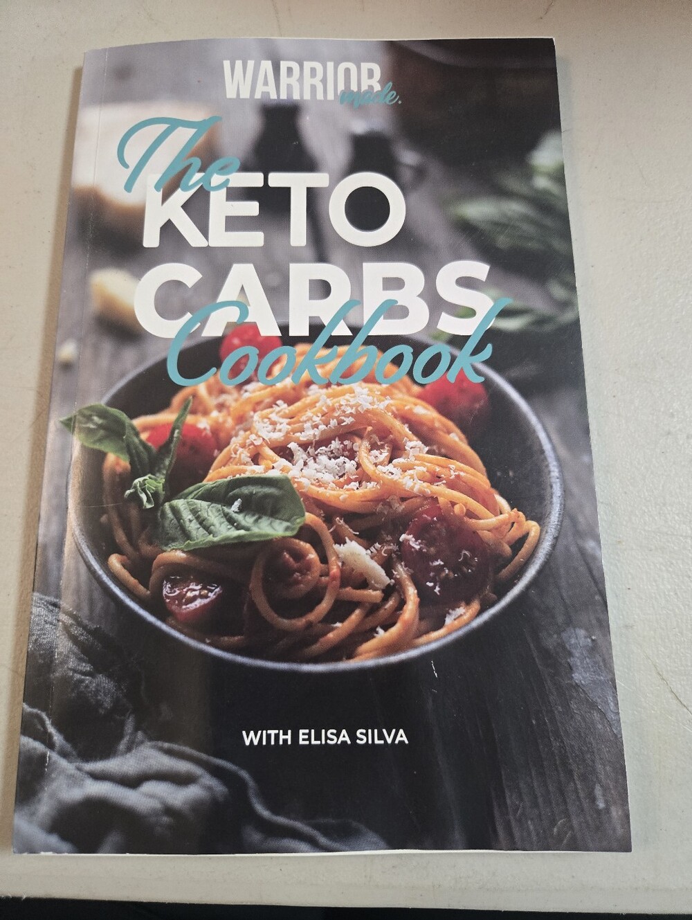 The Keto Carbs Cookbook by - Teal & Black Cover